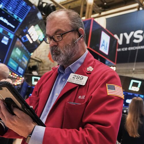 Trader William Lawrence works on the floor of the New York Stock Exchange, Thursday, Dec. 11, 2025. (AP Photo/Richard Drew)