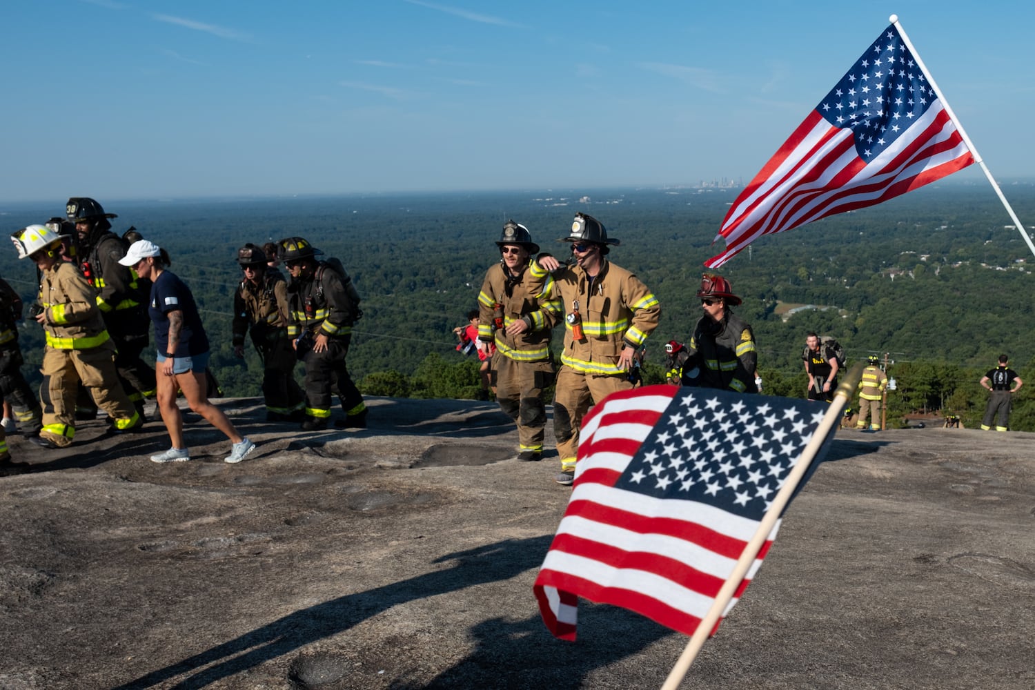 Firefighters make it to the summit of Stone Mountain during the annual 9/11 memorial on Thursday, Sept. 11, 2025.   Ben Gray for the Atlanta Journal-Constitution