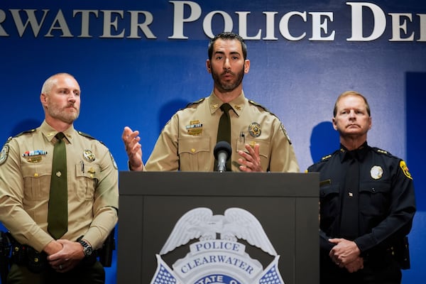 Matthew Dallarosa, center, of the Florida Fish and Wildlife Conservation Commission, flanked by Evan Laskowski, left, also of FWC, and Clearwater, Fla., Police Chief Eric Gandy, right, speaks during a news conference Monday, April 28, 2025, in Clearwater, Fla., after a deadly boating accident Sunday night. (AP Photo/Chris O'Meara)