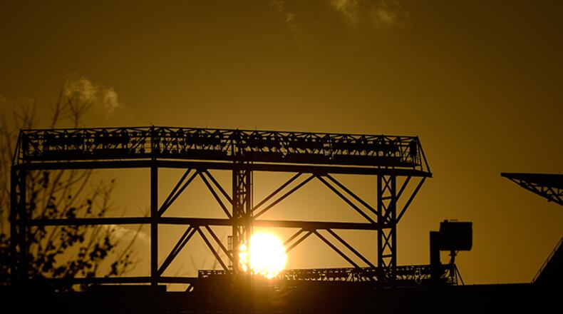 The sun rises over Turner Field after a night of unsettled weather across the South, on Monday, Nov. 24, 2014, in Atlanta.