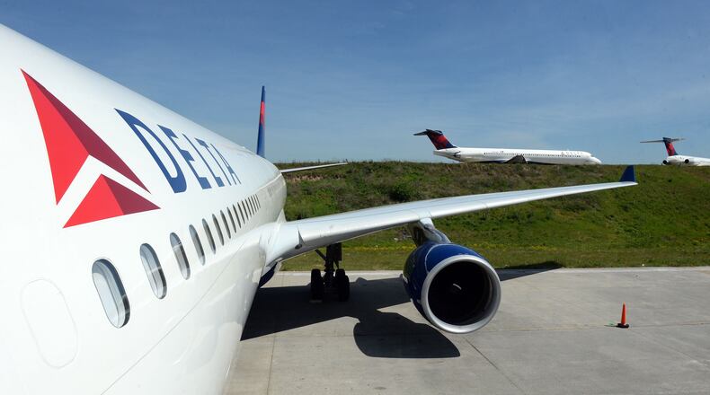 The exterior of the A330-300 is shown as aircraft taxi for take off in the background. KENT D. JOHNSON /kdjohnson@ajc.com