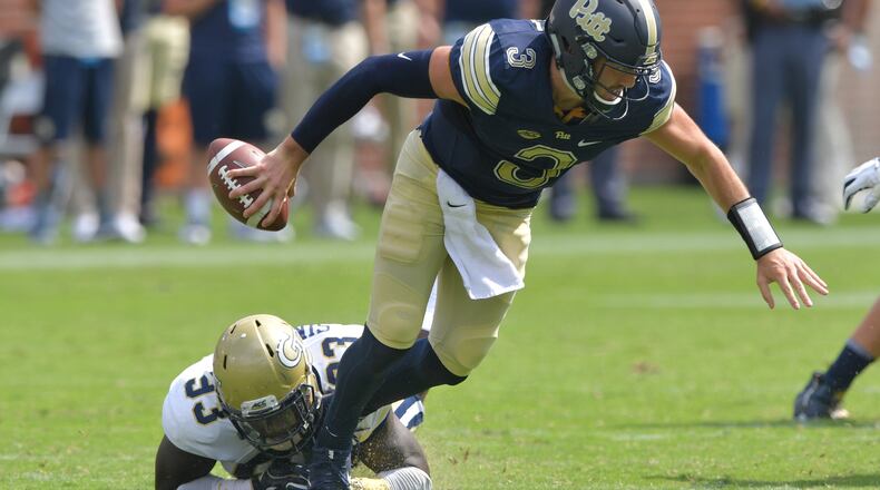 September 23, 2017 Atlanta - Pittsburgh quarterback Ben Dinucci (3) gets tackled from behind by Georgia Tech defensive lineman Antonio Simmons (93) in the second half of an NCAA college football game at Bobby Dodd Stadium on Saturday, September 23, 2017. Georgia Tech won 35 - 17 over the Pittsburgh. HYOSUB SHIN / HSHIN@AJC.COM