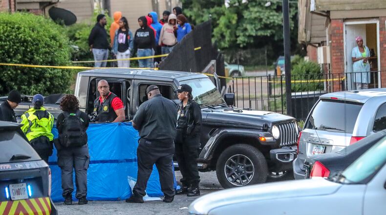 May 10, 2022 Atlanta: Atlanta police work the scene at the Forest Cove Apartments on New Town Circle. Investigators are working to learn what happened before a gunshot victim ended up dead Tuesday morning, May 10, 2022 at a southeast Atlanta apartment complex. (John Spink / John.Spink@ajc.com)