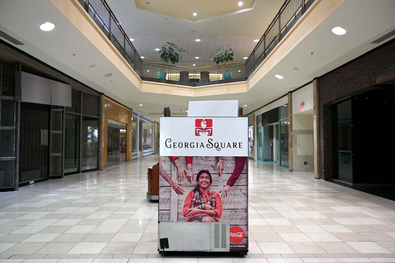 A "Georgia Square" sign sits in the middle of a nearly empty Georgia Square Mall in Athens in May 2025. (Hyosub Shin/AJC)