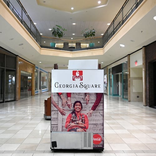 A "Georgia Square" sign sits in the middle of a nearly empty Georgia Square Mall in Athens in May 2025. (Hyosub Shin/AJC)