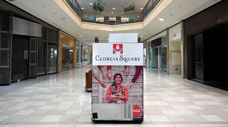 A "Georgia Square" sign sits in the middle of a nearly empty Georgia Square Mall in Athens in May 2025. (Hyosub Shin/AJC)