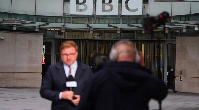 Journalists report outside BBC Broadcasting House in London, Tuesday, Nov. 11, 2025. (AP Photo/Kirsty Wigglesworth)