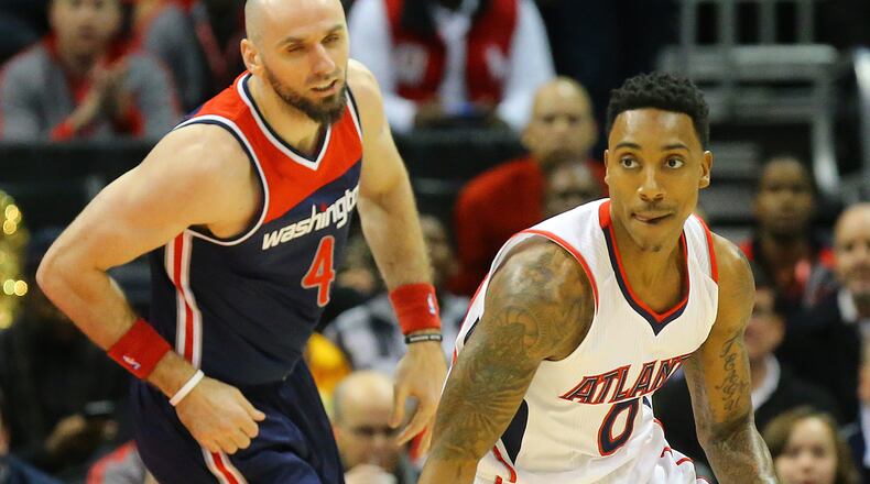 020415 ATLANTA: Hawks guard Jeff Teague steals from Wizzards center Marcin Gortat during a basketball game on Wednesday, Feb 4, 2015, in Atlanta. Curtis Compton / ccompton@ajc.com
