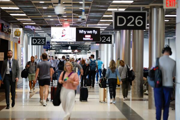 Travelers walk along Concourse D, which was recently expanded, at Hartsfield-Jackson Atlanta International Airport on Wednesday, Sept. 17, 2025. The world's busiest airport relies on federal funding for its capital expenditure projects — including this latest project set to last through 2029. (Miguel Martinez/ AJC)