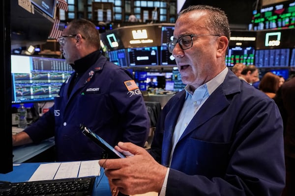 Trader David Fox, right, and specialist Anthony Matesic work on the floor of the New York Stock Exchange, Monday, June 9, 2025. (AP Photo/Richard Drew)