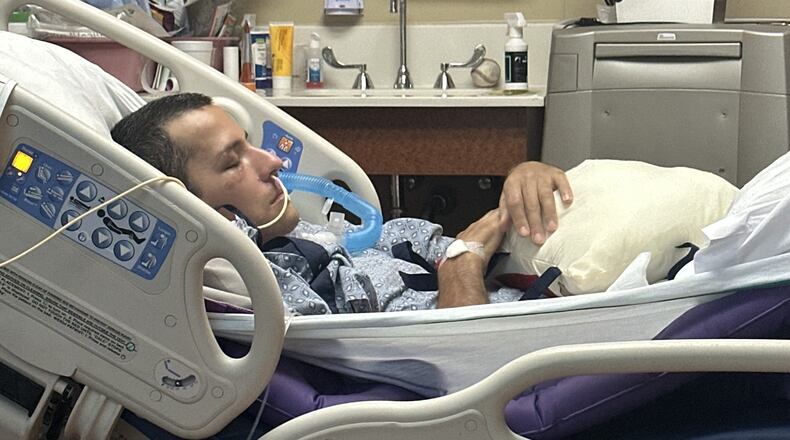Mark Moczarski awoke from a two-week coma just as he was being put on a plane to fly back to Georgia. He is now being treated at Northside Hospital Gwinnett. (Courtesy Moczarski family)
