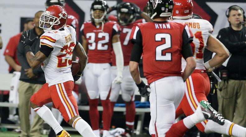 Kansas City Chiefs strong safety Eric Berry (29) runs back an intercepted ball from a Atlanta Falcons two-point conversion during the second half of an NFL football game, Sunday, Dec. 4, 2016, in Atlanta. (AP Photo/Chuck Burton)