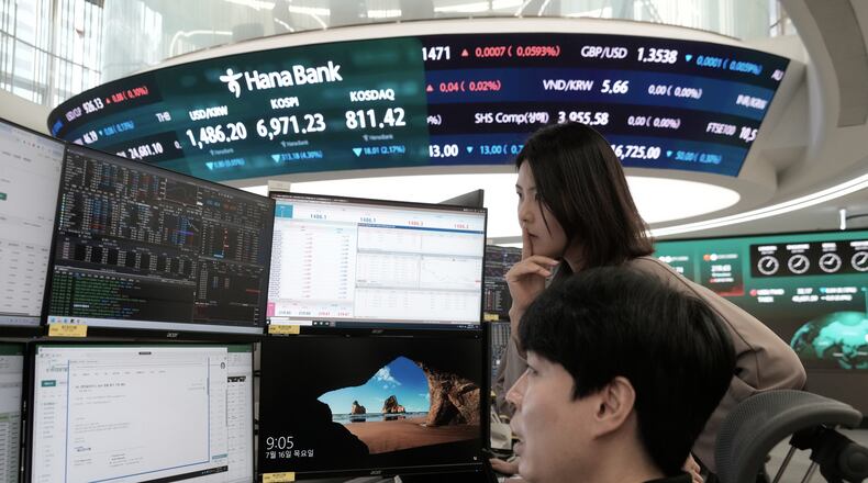 Currency traders watch monitors at the foreign exchange dealing room of the Hana Bank headquarters in Seoul, South Korea, Thursday, July 16, 2026. (AP Photo/Ahn Young-joon)