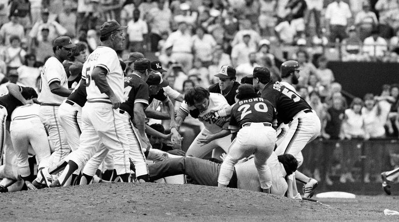 The Braves’ Braves Rick Mahler (center) is dragged away by the Padres’ Rich Gossage (right), Bobby Brown and others during an Aug. 12, 1984, brawl at Atlanta-Fulton County Stadium.
