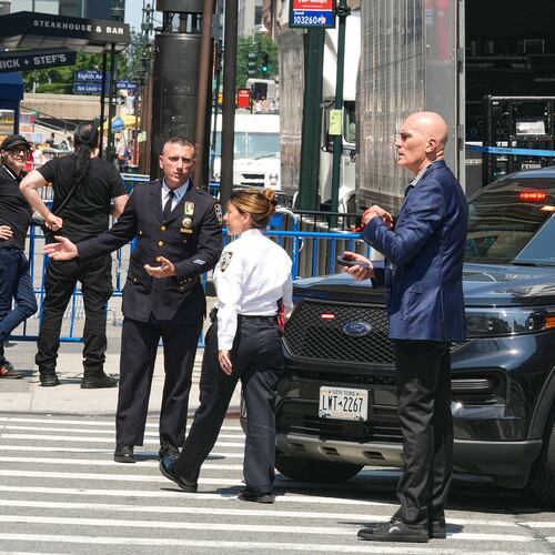 Security personnel meet outside New York's Madison Square Garden, Wednesday, July 1, 2026. (AP Photo/Richard Drew)