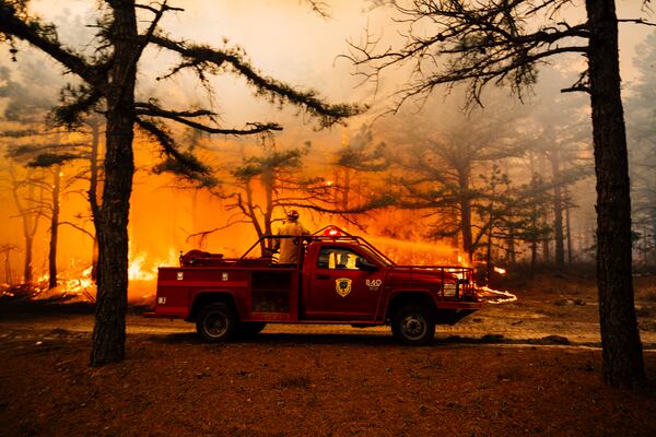 Firefighters battle a wildfire in Ocean County, N.J. on Thursday, April 24, 2025. (New Jersey Department of Environmental Protection via AP)