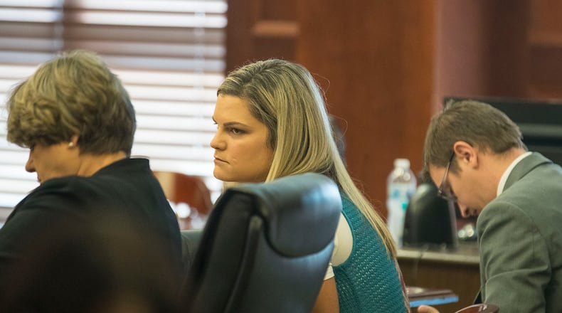 7/26/2019 -- McDonough, Georgia -- Jennifer Rosenbaum (center) looks toward her attorney, Corinne Mull (left), before the start of the days' trial for her and her husband, Joseph Rosenbaum, in front of Henry County Judge Brian Amero at the Henry County Superior courthouse, Friday, July 26, 2019. (Alyssa Pointer/alyssa.pointer@ajc.com)