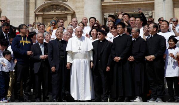 FILE - Pope Francis poses a group of faithful and bishops from Shanghai during his weekly general audience in St. Peter's square at the Vatican Wednesday, May 22, 2019. (AP Photo/Alessandra Tarantino, File)