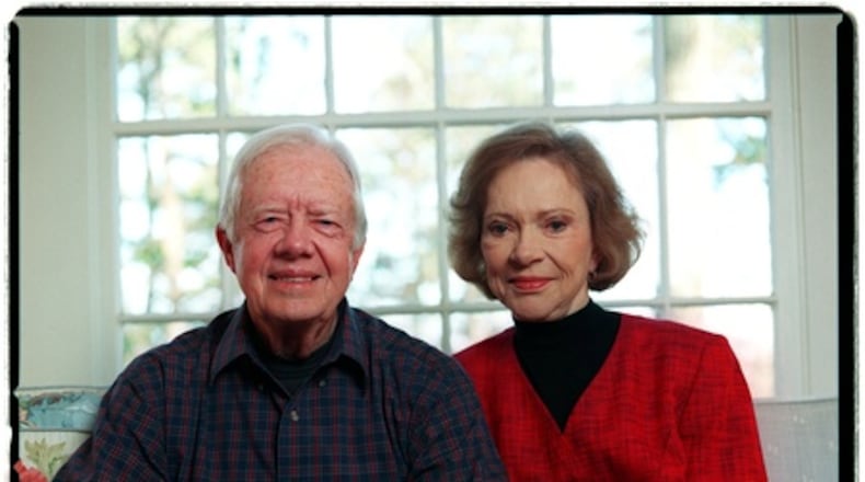 Jimmy and Rosalynn Carter sit inside their Plains home in February 2002. The former president chose an in-home hospice program instead of frequent hospital visits. (Bita Honarvar/AJC)
