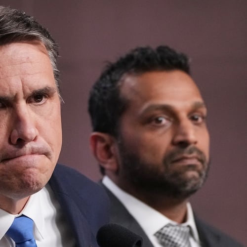 Acting Attorney General Todd Blanche speaks as FBI Director Kash Patel listens during a news conference at the Justice Department, Tuesday, April 21, 2026, in Washington. (AP Photo/Jacquelyn Martin)