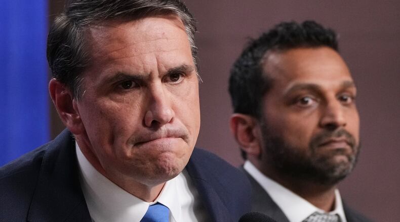 Acting Attorney General Todd Blanche speaks as FBI Director Kash Patel listens during a news conference at the Justice Department, Tuesday, April 21, 2026, in Washington. (AP Photo/Jacquelyn Martin)