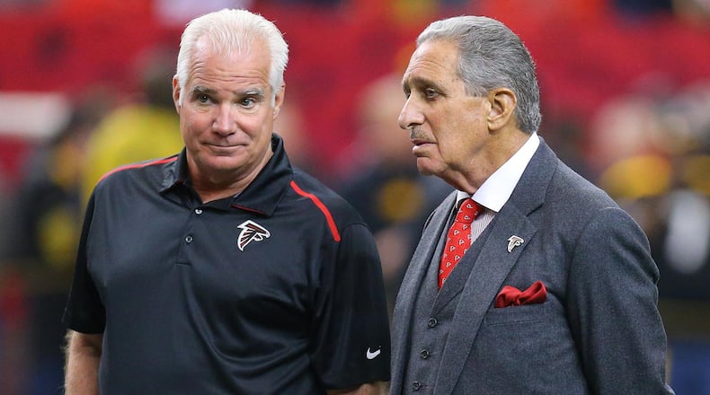 121414 ATLANTA: Falcons head coach Mike Smith and team owner Arthur Blank watch over team warmups before playing the Steelers in a football on Sunday, Dec. 14, 2014, in Atlanta. CURTIS COMPTON / CCOMPTON@AJC.COM Arthur Blank can't be happy with Mike Smith's record or fans abandoning his team. (Curtis Compton, ccompton@ajc.com)