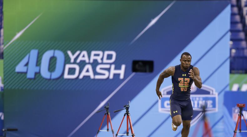 Georgia wide receiver Isaiah Mckenzie runs the 40-yard dash at the NFL football scouting combine in Indianapolis, Saturday, March 4, 2017. (AP Photo/Michael Conroy)