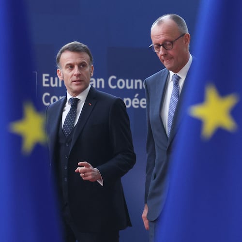 Germany's Chancellor Friedrich Merz, right, and French President Emmanuel Macron walk together as they arrive for the EU summit at the European Council building in Brussels, Thursday, March 19, 2026. (AP Photo/Omar Havana)