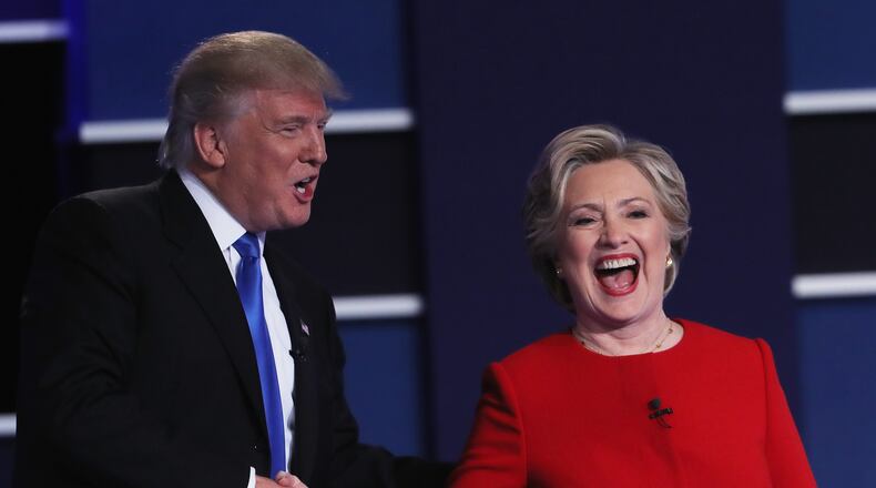 Donald Trump and Hillary Clinton shake hands after the first presidential debate. (Photo by Spencer Platt/Getty Images)