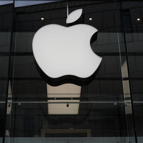 FILE - The Apple logo is illuminated at a store in Munich, Germany, April 2, 2026. (AP Photo/Matthias Schrader, File)