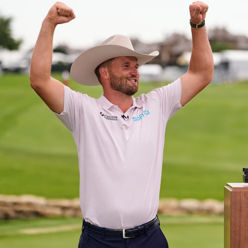 Wyndham Clark celebrates after winning the CJ Cup Byron Nelson golf tournament in McKinney, Texas, Sunday, May 24, 2026. (AP Photo/Tony Gutierrez)