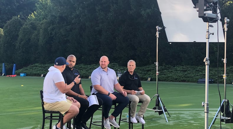 ACC Network analysts (from right to left) Mark Richt, Eric Mac Lain and Jordan Cornette listen to Georgia Tech coach Geoff Collins (in white shirt and shorts) during a taping of a program previewing Tech's season. (AJC photo by Ken Sugiura)