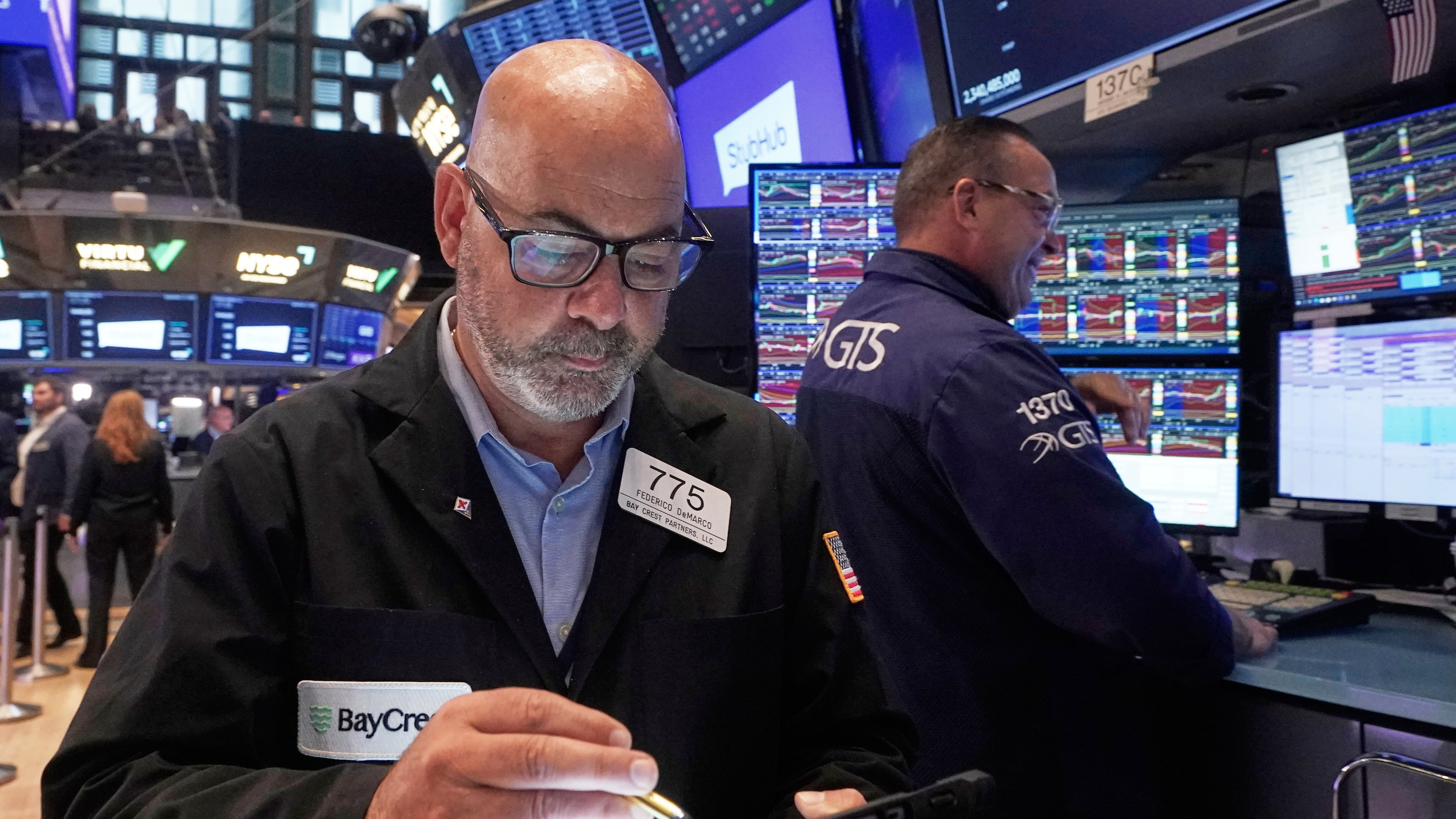 Trader Fred Fred Demarco, left, works on the floor of the New York Stock Exchange, Wednesday, Sept. 17, 2025. (AP Photo/Richard Drew)