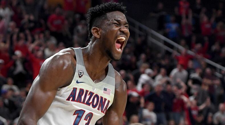 LAS VEGAS, NV - MARCH 10:  Deandre Ayton #13 of the Arizona Wildcats reacts after dunking against the USC Trojans during the championship game of the Pac-12 basketball tournament at T-Mobile Arena on March 10, 2018 in Las Vegas, Nevada. The Wildcats won 75-61.  (Photo by Ethan Miller/Getty Images)