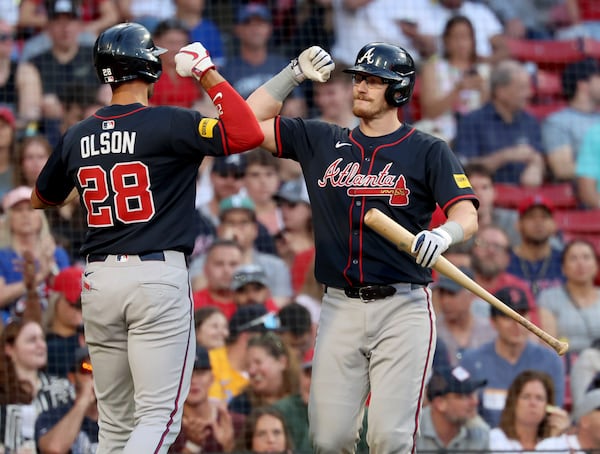Atlanta Braves' Matt Olson (28) celebrates after his home run with teammate Sean Murphy, right, during the second inning of a baseball game against the Boston Red Sox, Friday, May 16, 2025, in Boston. (AP Photo/Mark Stockwell)