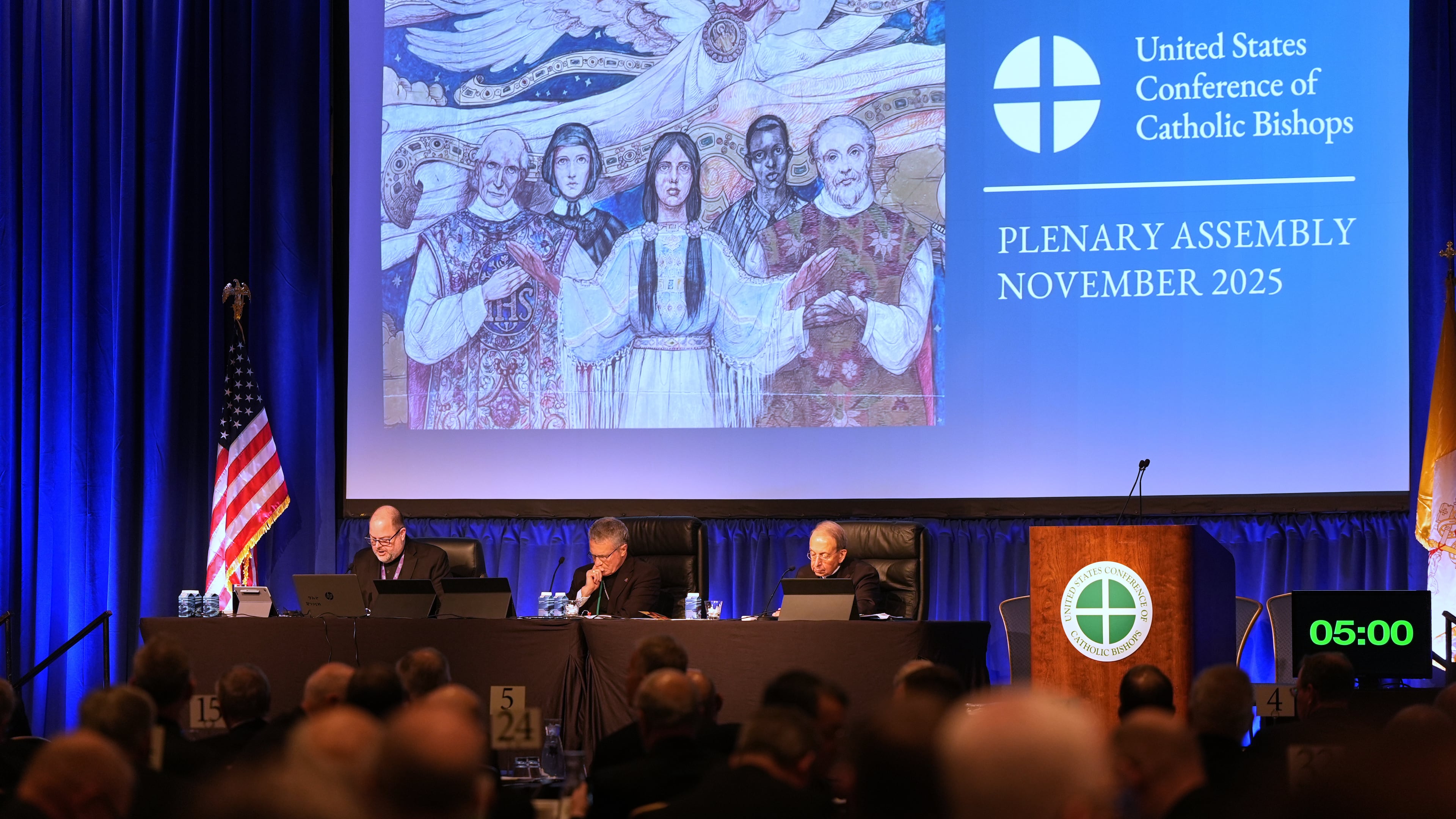 From left; Rev. Michael J.K. Fuller, Archbishop Timothy Broglio and Archbishop William Lori of Baltimore conduct the United States Conference of Catholic Bishops plenary assembly in Baltimore, Tuesday, Nov. 11, 2025. (AP Photo/Stephanie Scarbrough)