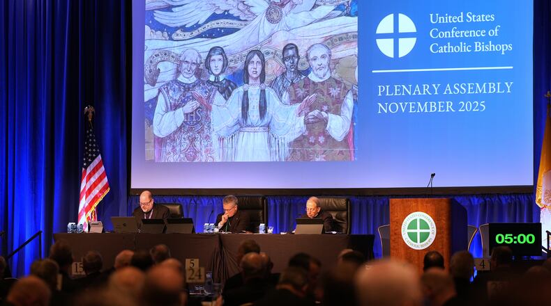 From left; Rev. Michael J.K. Fuller, Archbishop Timothy Broglio and Archbishop William Lori of Baltimore conduct the United States Conference of Catholic Bishops plenary assembly in Baltimore, Tuesday, Nov. 11, 2025. (AP Photo/Stephanie Scarbrough)