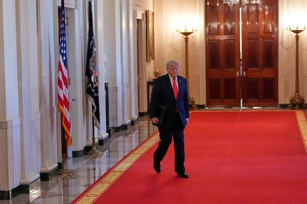 President Donald Trump arrives to speak at the Commander-in-Chief trophy presentation to the Navy Midshipman football team in the East Room of the White House, Tuesday, April 15, 2025, in Washington. (AP Photo/Alex Brandon)