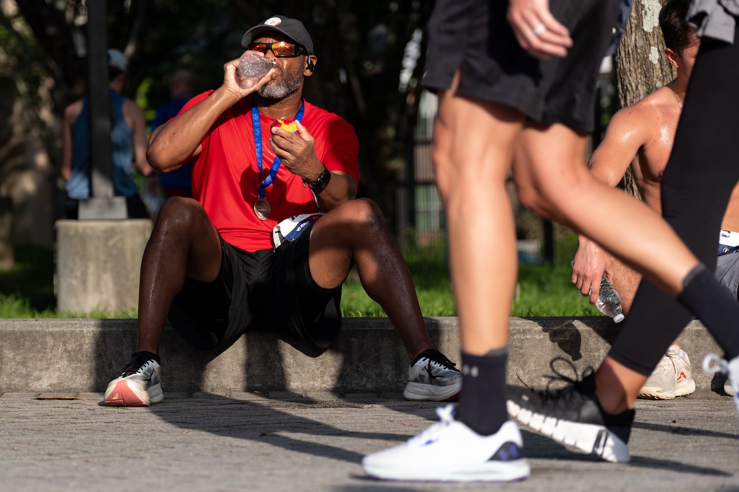 Dawayne Eason hydrates after finishing the MLB All-Star 4.4 Miler in Atlanta on Sunday, July 13, 2025.   Ben Gray for the Atlanta Journal-Constitution