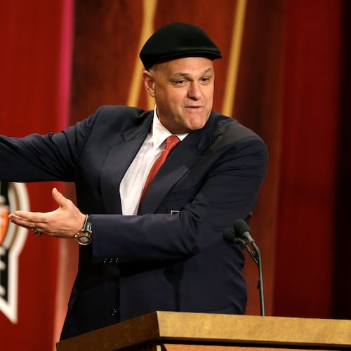 FILE - Inductee Oscar Schmidt, of Brazil, speaks during the enshrinement ceremony for this year's class of the Basketball Hall of Fame, at Symphony Hall in Springfield, Mass., Sept. 8, 2013. Schmidt, whom his Brazil compatriots know as the “Holy Hand,” died. Friday, April 17, 2026. He was 68. (AP Photo/Steven Senne, File)