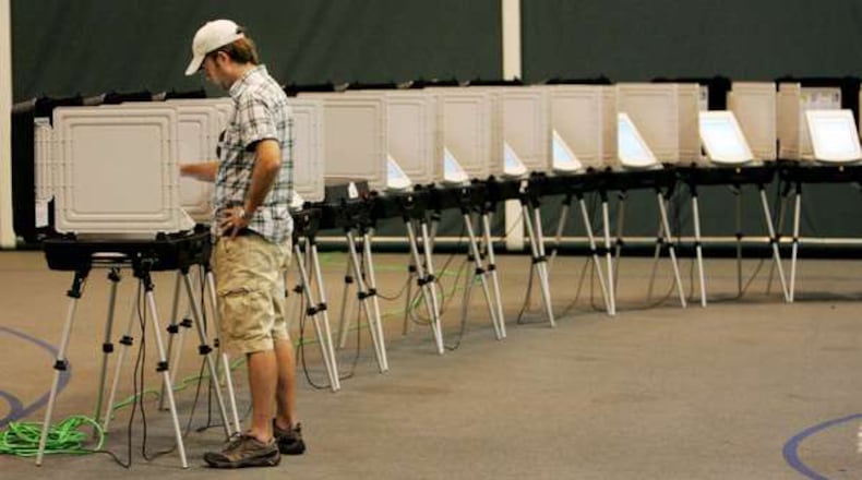 A lone voter has his pick of many voting machines at Johns Creek Baptist Church in this March 2016 file photo.