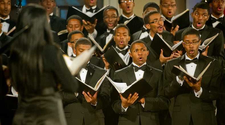 Tyler Hill (right) and Raymond Bell perform on stage during the 86th Annual Morehouse-Spelman Christmas Carol Concert at the Sisters Chapel on campus on Saturday, December 1, 2012. Close to 100 singers from both the Spelman College and Morehouse College glee clubs performed 28 holiday songs.