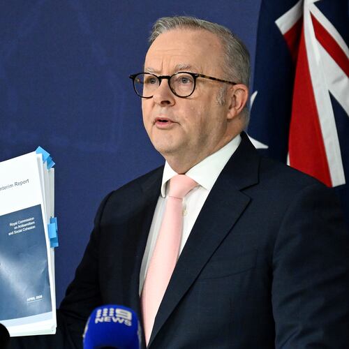 Australian Prime Minister Anthony Albanese holds up the report on Antisemitism and Social Cohesion during a press conference at the Commonwealth Parliamentary Offices in Sydney, Thursday, April 30, 2026. (Dan Himbrechts/AAP Image via AP)