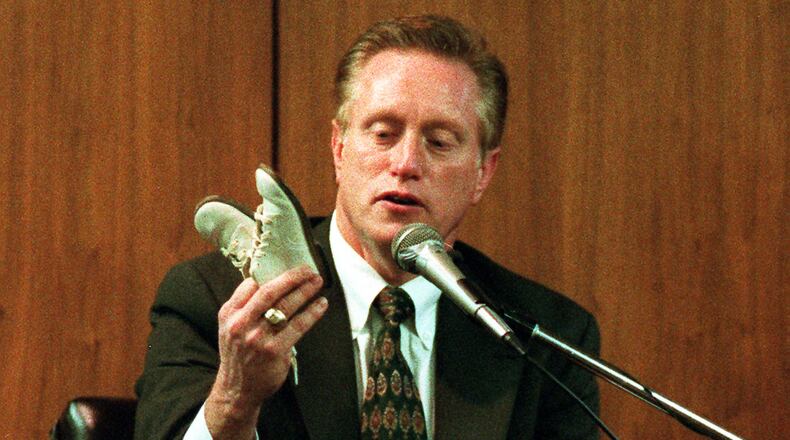 Joe Burton, medical examiner for Cobb, Gwinnett, DeKalb, Clayton, Douglas, Paulding and Rockdale counties during the 1980s and 1990s, testifies during a trial in 1997. (AJC file image)