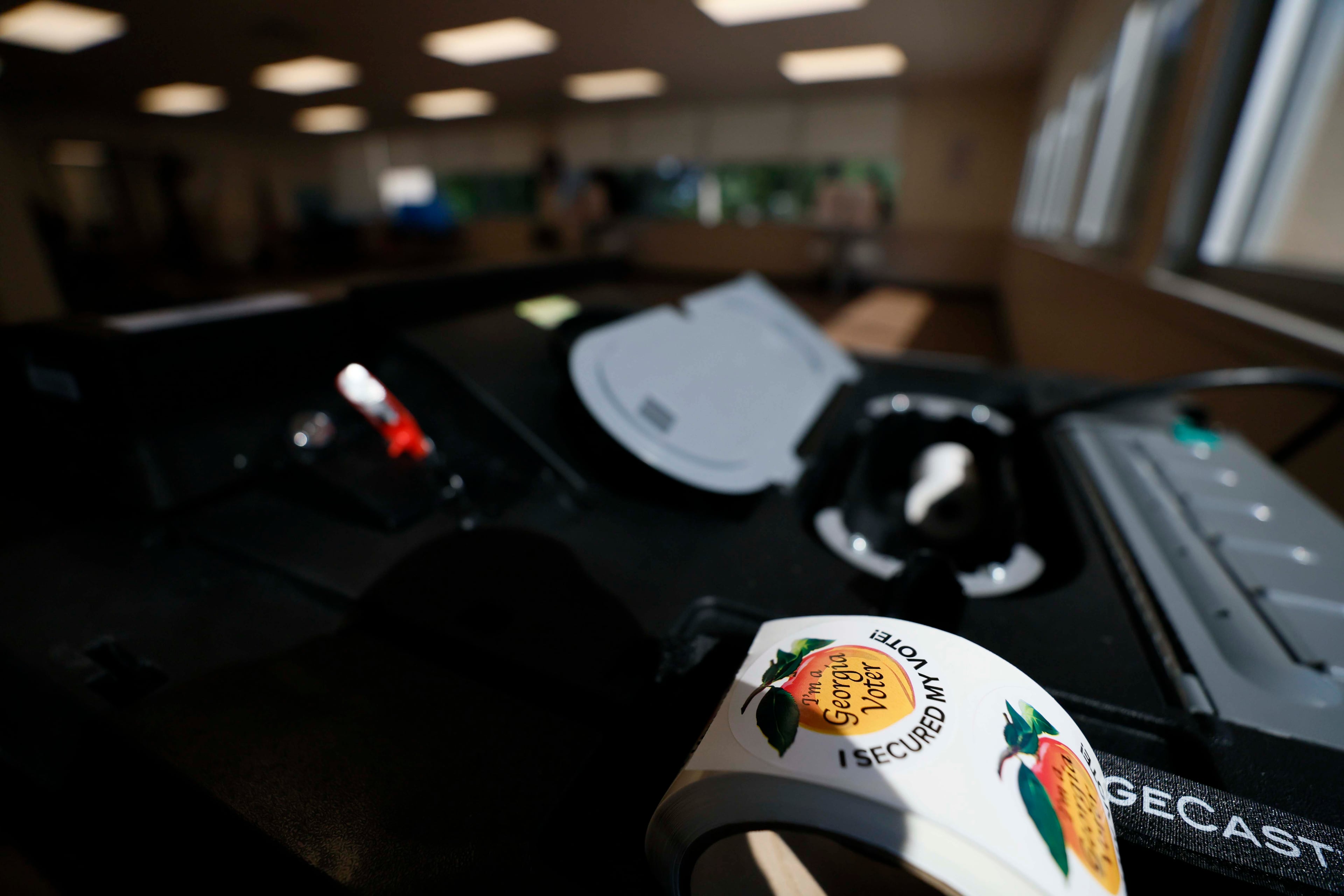 A Georgia voter stickers are seen at the Cherokee County Voting and Registration office during the runoff elections for the Public Service Commission on Tuesday, July 8, 2025.
(Miguel Martinez/ AJC)