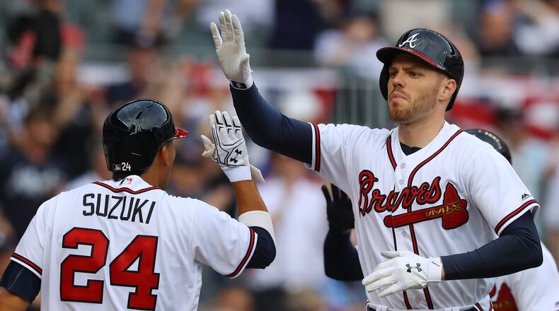 Freddie Freeman’s two-run homer started the Braves’ eight-run rally Thursday. (Curtis Compton/ccompton@ajc.com)