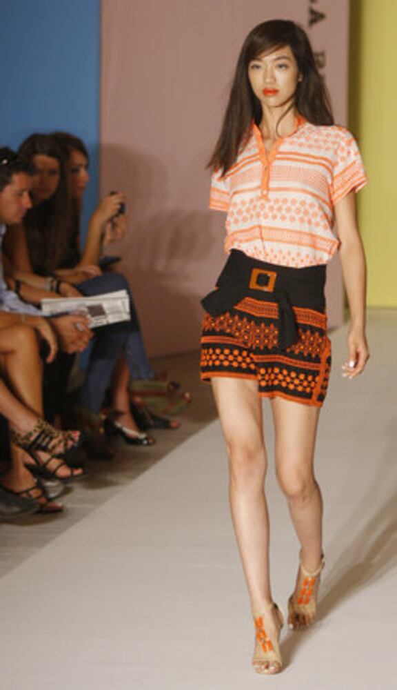 Models take the catwalk during Milan Fashion Week 2011