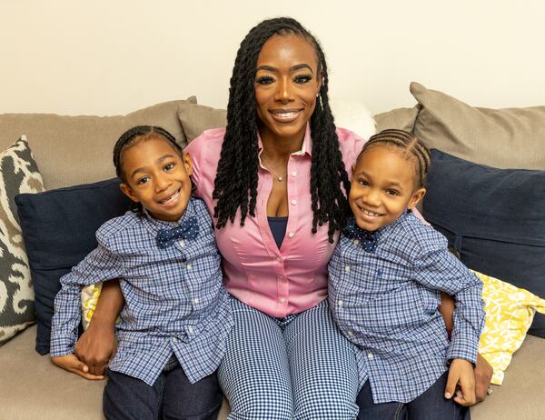 Shea Guillory and 6-year-old twins Sawyer, left, and Saxton, right, are at their home Monday, January 17, 2022.  Guillory manages the busy boys and  Sawyer's sickle-cell disease while home schooling with help from her mother; while her husband works as a government contractor.  (Jenni Girtman for The Atlanta Journal-Constitution)