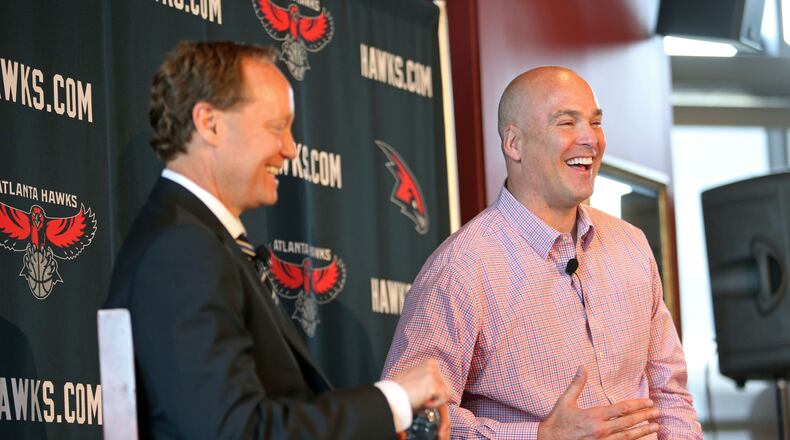 Atlanta Hawks general manager Danny Ferry, right, and Atlanta Hawks new coach Mike Budenholzer react to a question from the media during Budenholzer's introductory news conference at Philips Arena Wednesday morning in Atlanta. JASON GETZ / JGETZ@AJC.COM
