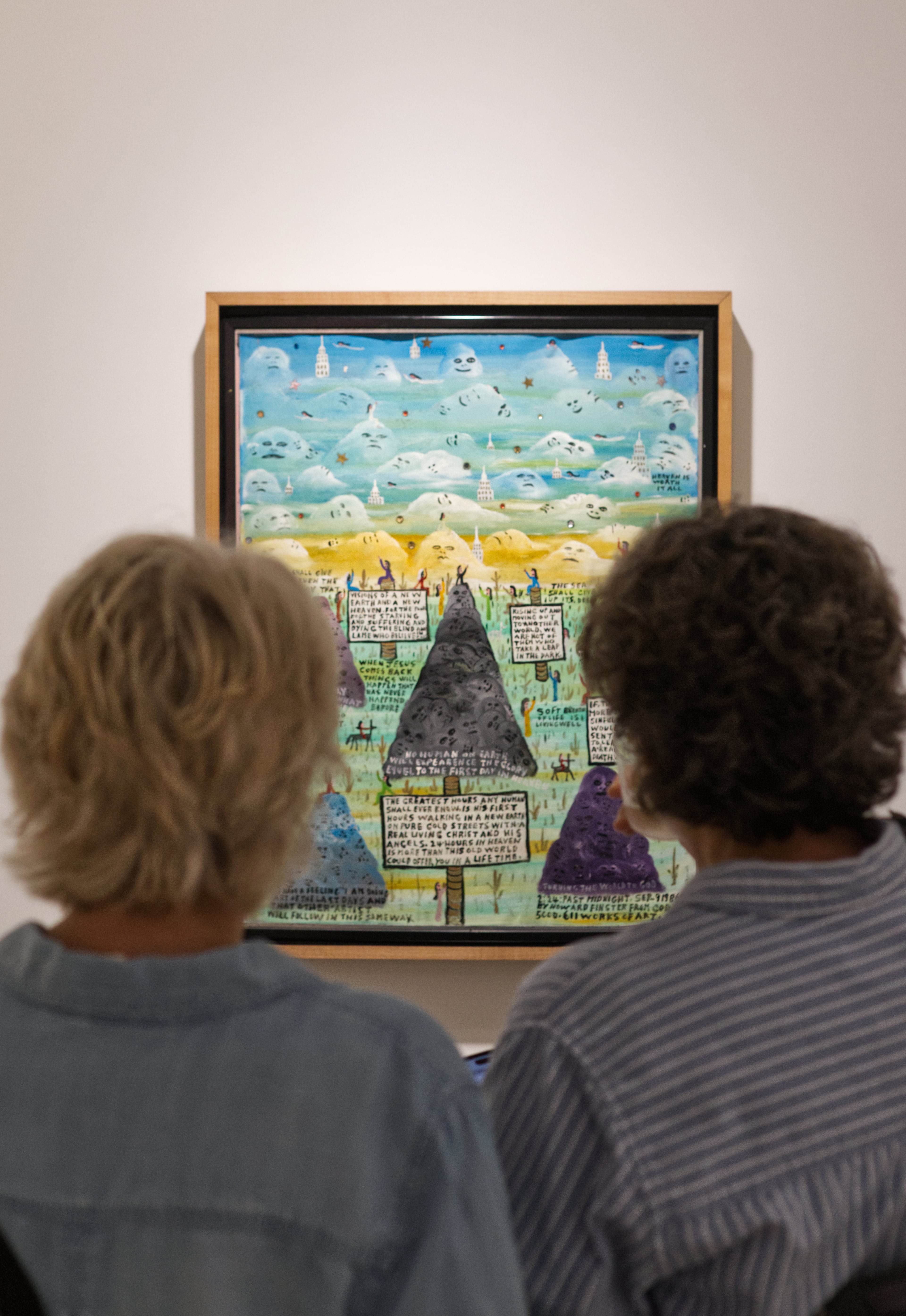 Viewing Howard Finster's "Visions of a New Earth" (1986). (Photo by Dustin Timbrook)
